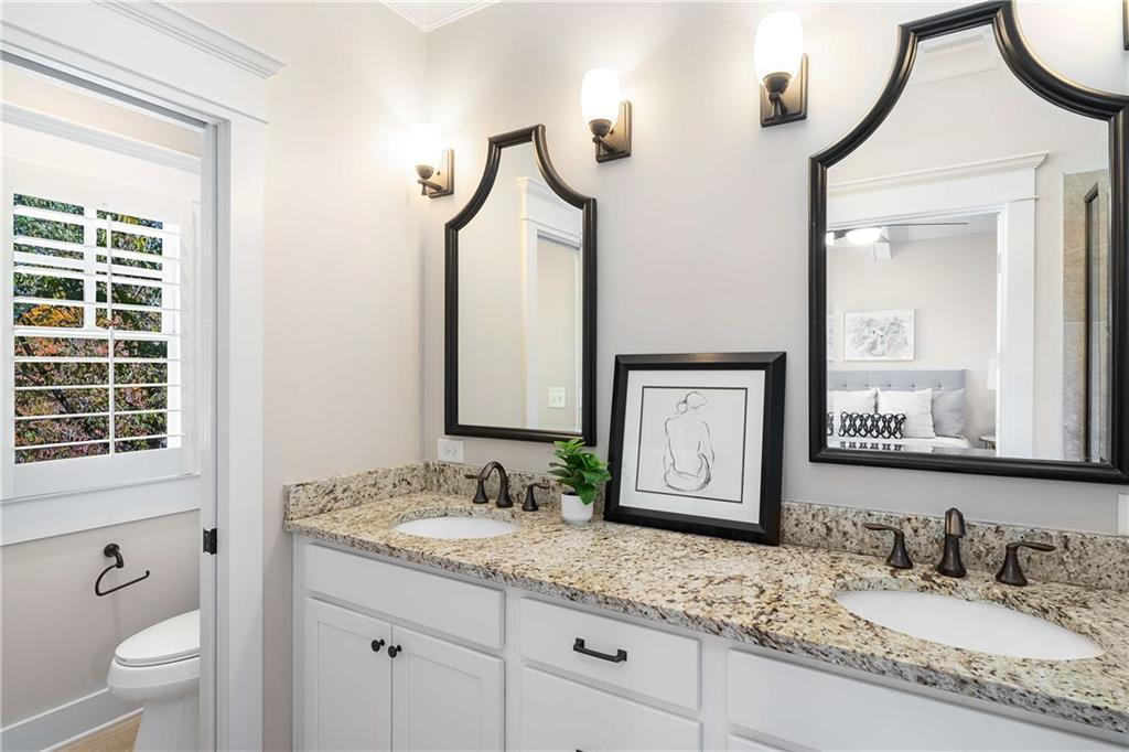 2003 Hibernia Bend Decatur, GA 30030 - Photo 28 of 52 a bathroom with a granite countertop sink and a mirror