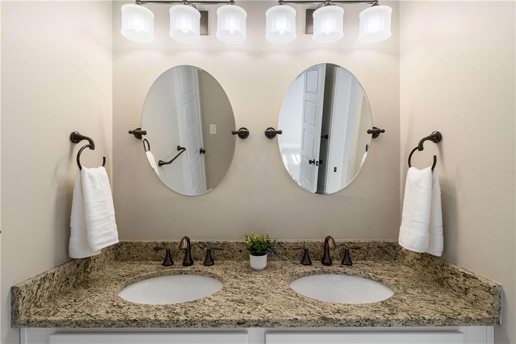 2003 Hibernia Bend Decatur, GA 30030 - Photo 34 of 52 a bathroom with a granite countertop sink and a mirror
