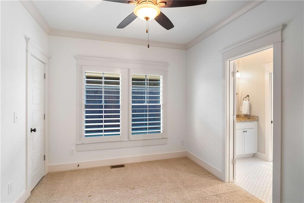 2003 Hibernia Bend Decatur, GA 30030 - Photo 36 of 52 a view of empty room with a ceiling fan and window