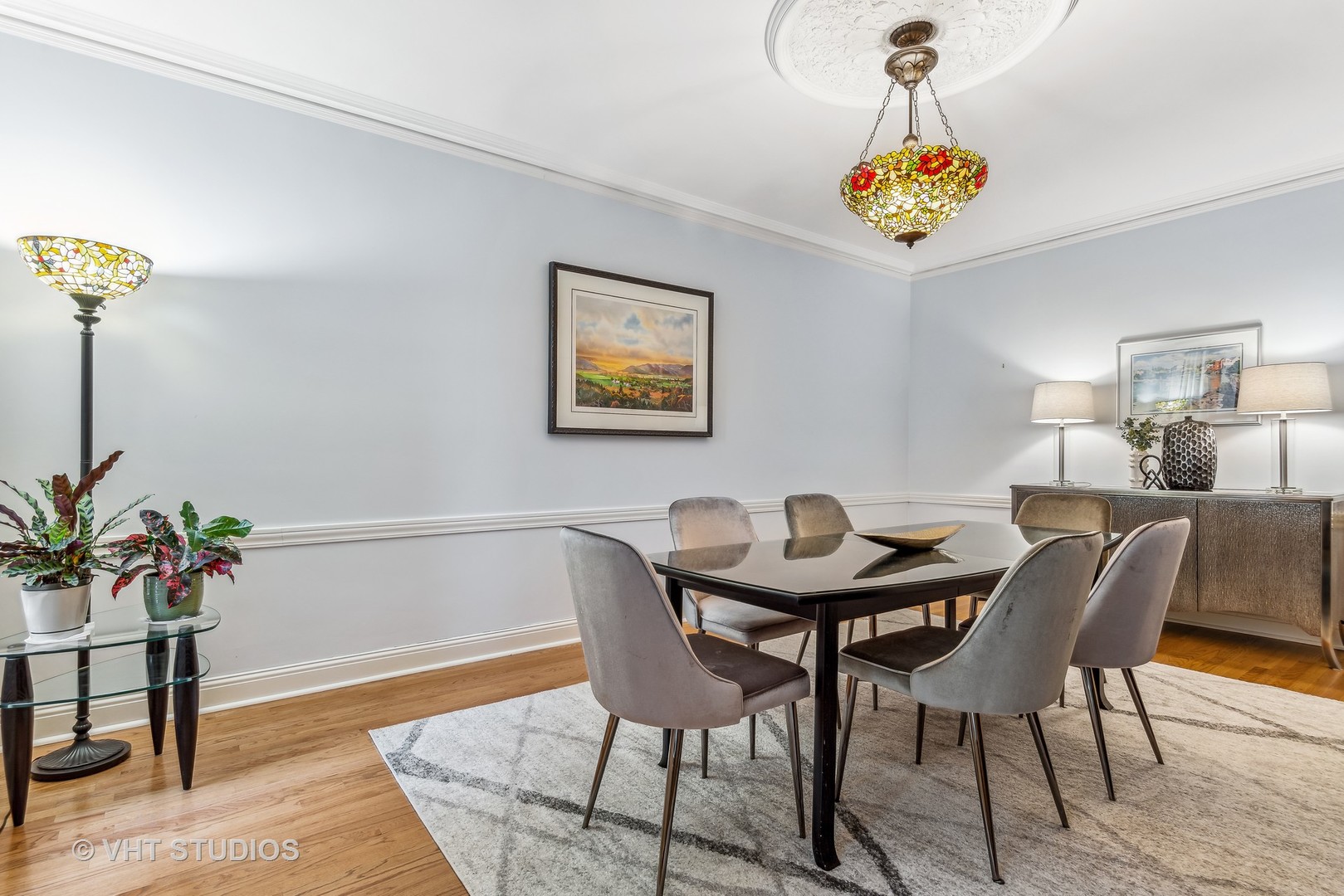3100 North Sheridan Road, Unit 8B Chicago, IL 60657 - Photo 12 of 28 a view of a dining room with furniture and wooden floor