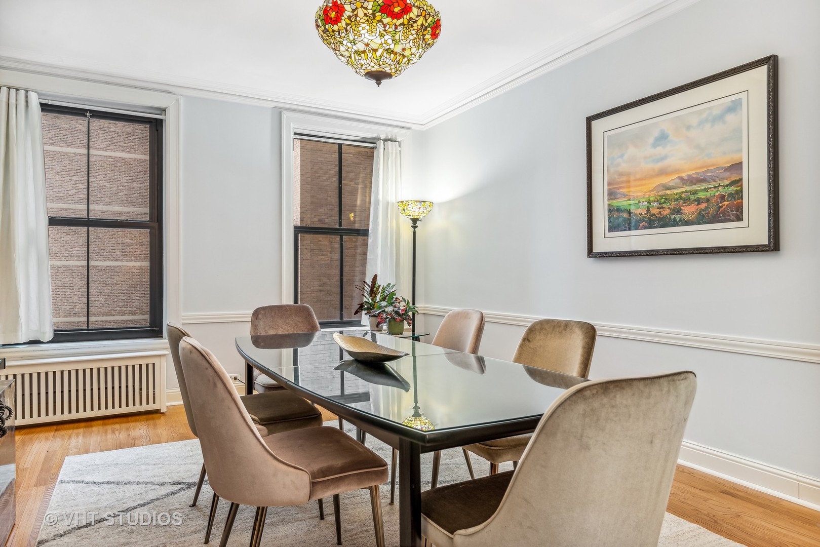 3100 North Sheridan Road, Unit 8B Chicago, IL 60657 - Photo 13 of 28 a view of a dining room with furniture and wooden floor