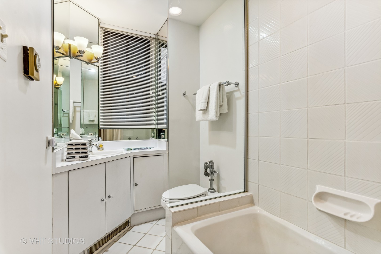 3100 North Sheridan Road, Unit 8B Chicago, IL 60657 - Photo 21 of 28 a bathroom with a granite countertop sink a toilet and shower
