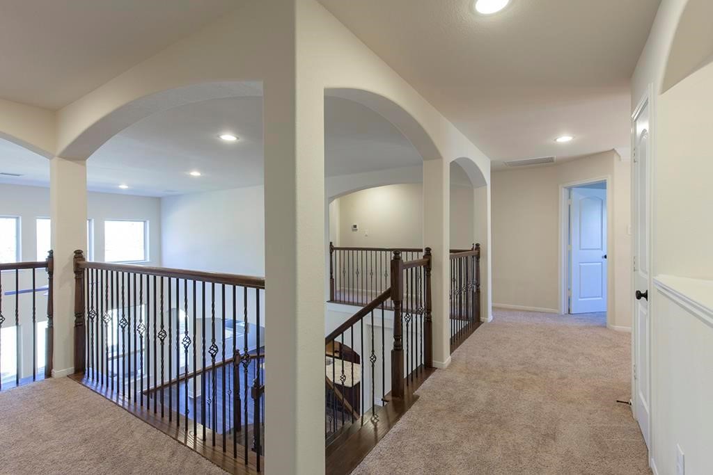 10402 Southern Hawker Conroe, TX 77385 - Photo 13 of 22 a view of a hallway with stairs