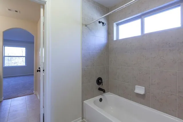 a bathroom with a bathtub