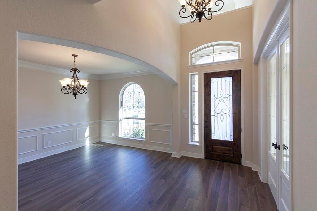 10402 Southern Hawker Conroe, TX 77385 - Photo 2 of 22 wooden floor in an empty room with a window