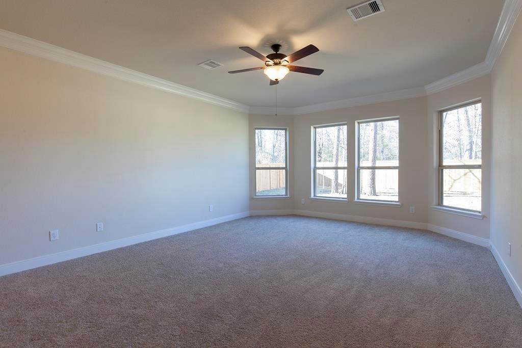 10402 Southern Hawker Conroe, TX 77385 - Photo 10 of 22 a view of an empty room with a window