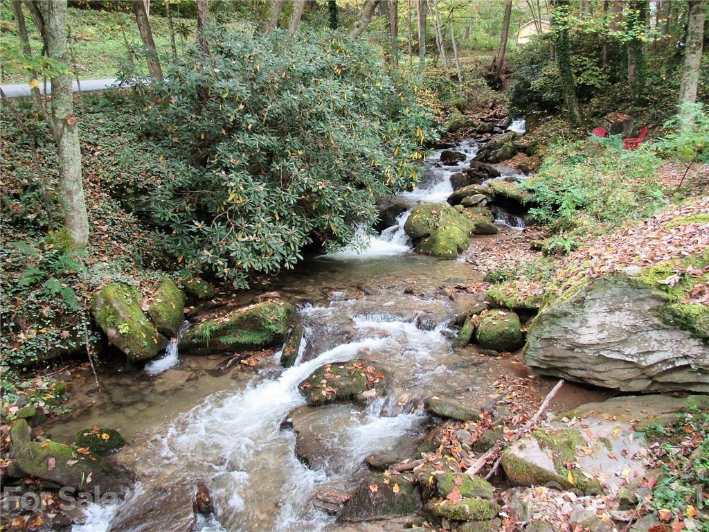 2506 Hemphill Road Waynesville, NC 28785 - Photo 1 of 37 a view of a garden with water