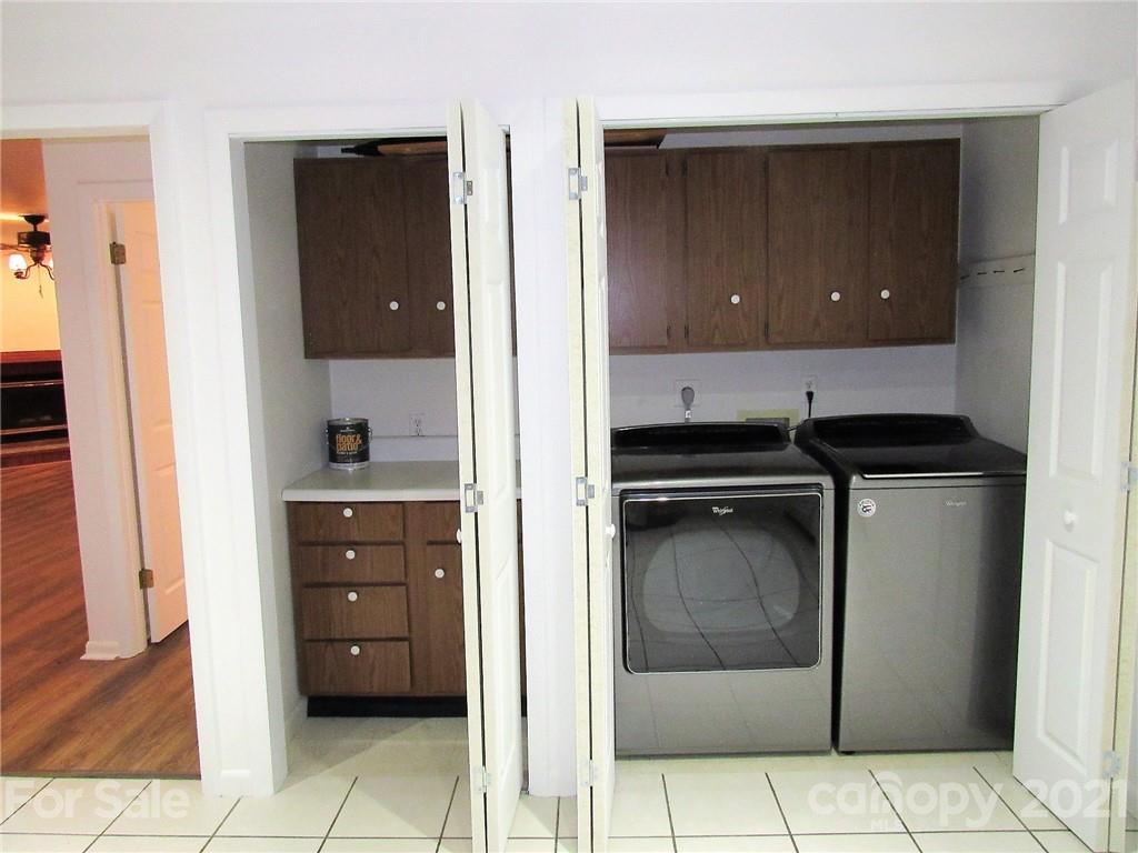 2506 Hemphill Road Waynesville, NC 28785 - Photo 10 of 37 a kitchen with a refrigerator and a stove