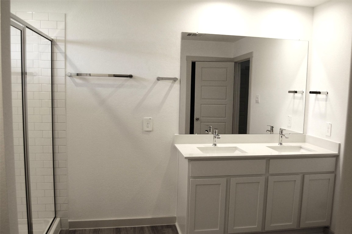 7702 Sleek Flock Lane Rosharon, TX 77583 - Photo 12 of 23 a bathroom with a sink and a mirror
