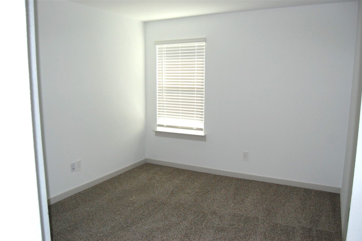 7702 Sleek Flock Lane Rosharon, TX 77583 - Photo 6 of 23 an empty room with a window