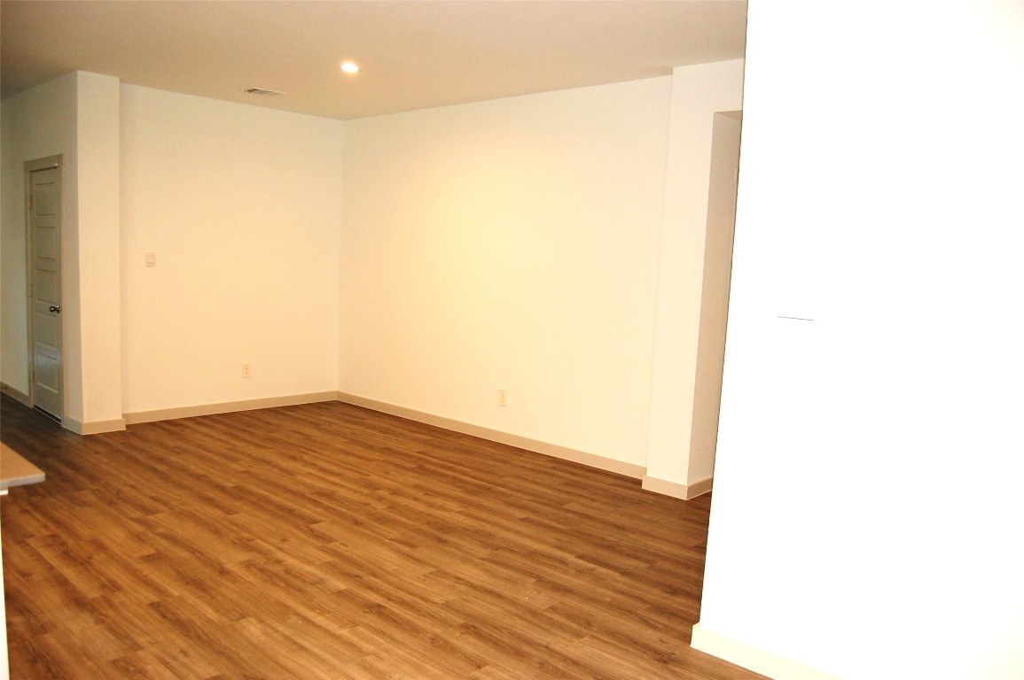 7702 Sleek Flock Lane Rosharon, TX 77583 - Photo 7 of 23 a view of a room with wooden floor