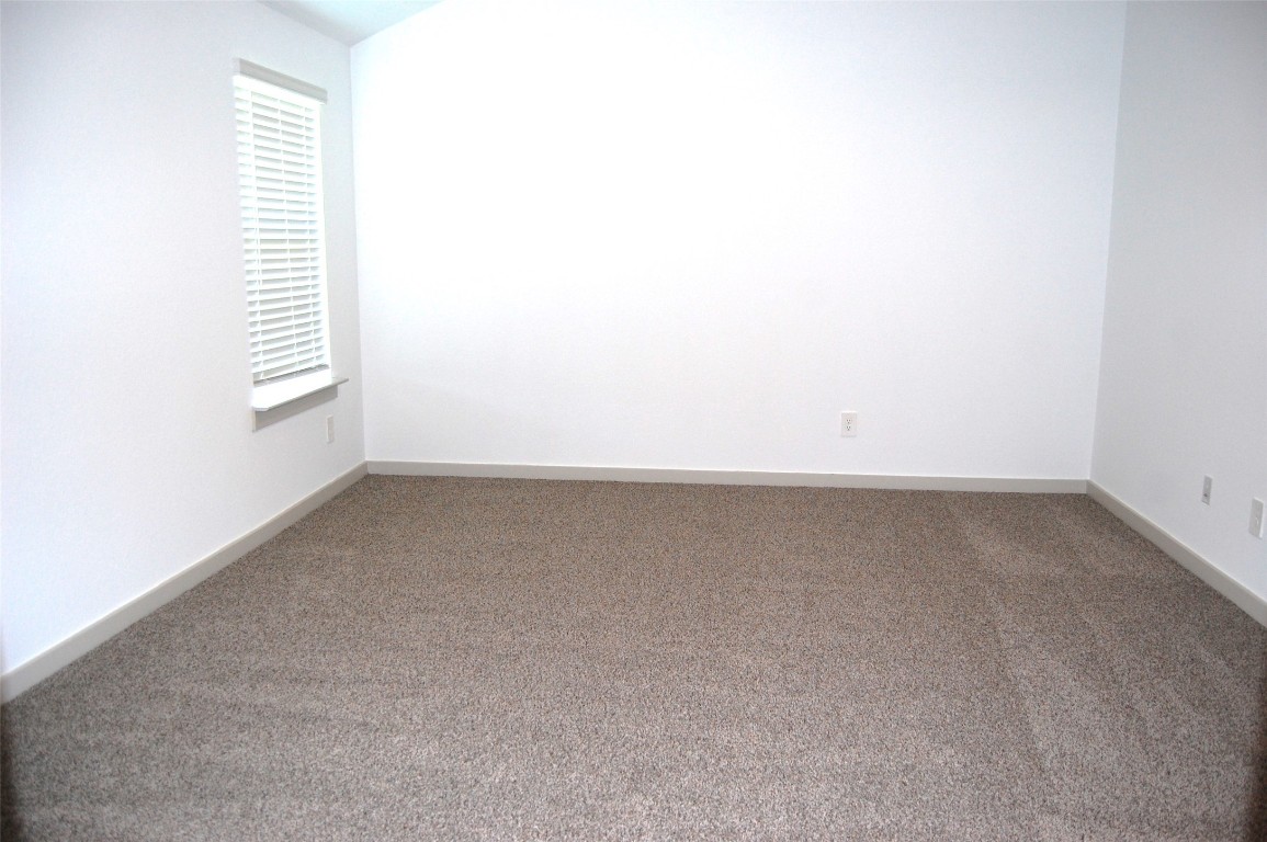 7702 Sleek Flock Lane Rosharon, TX 77583 - Photo 10 of 23 an empty room with a window