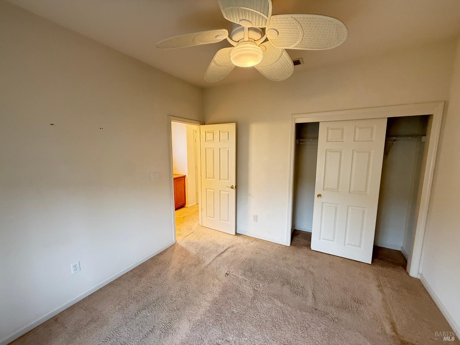 338 Gold Hills Drive Rio Vista, CA 94571 - Photo 11 of 27 an empty room with a window and a chandelier fan