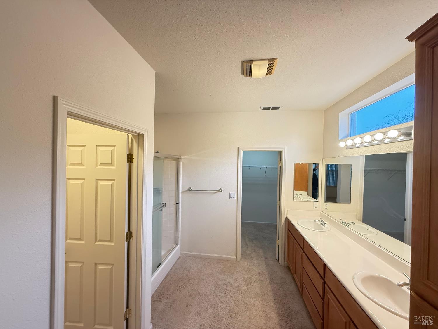 338 Gold Hills Drive Rio Vista, CA 94571 - Photo 14 of 27 a large bathroom with a double vanity sink and mirror