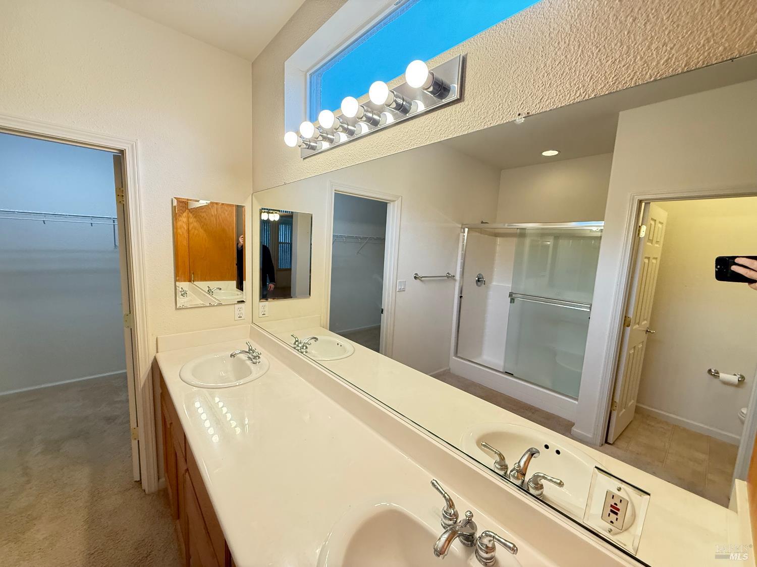 338 Gold Hills Drive Rio Vista, CA 94571 - Photo 16 of 27 a spacious bathroom with a double vanity sink a mirror and shower