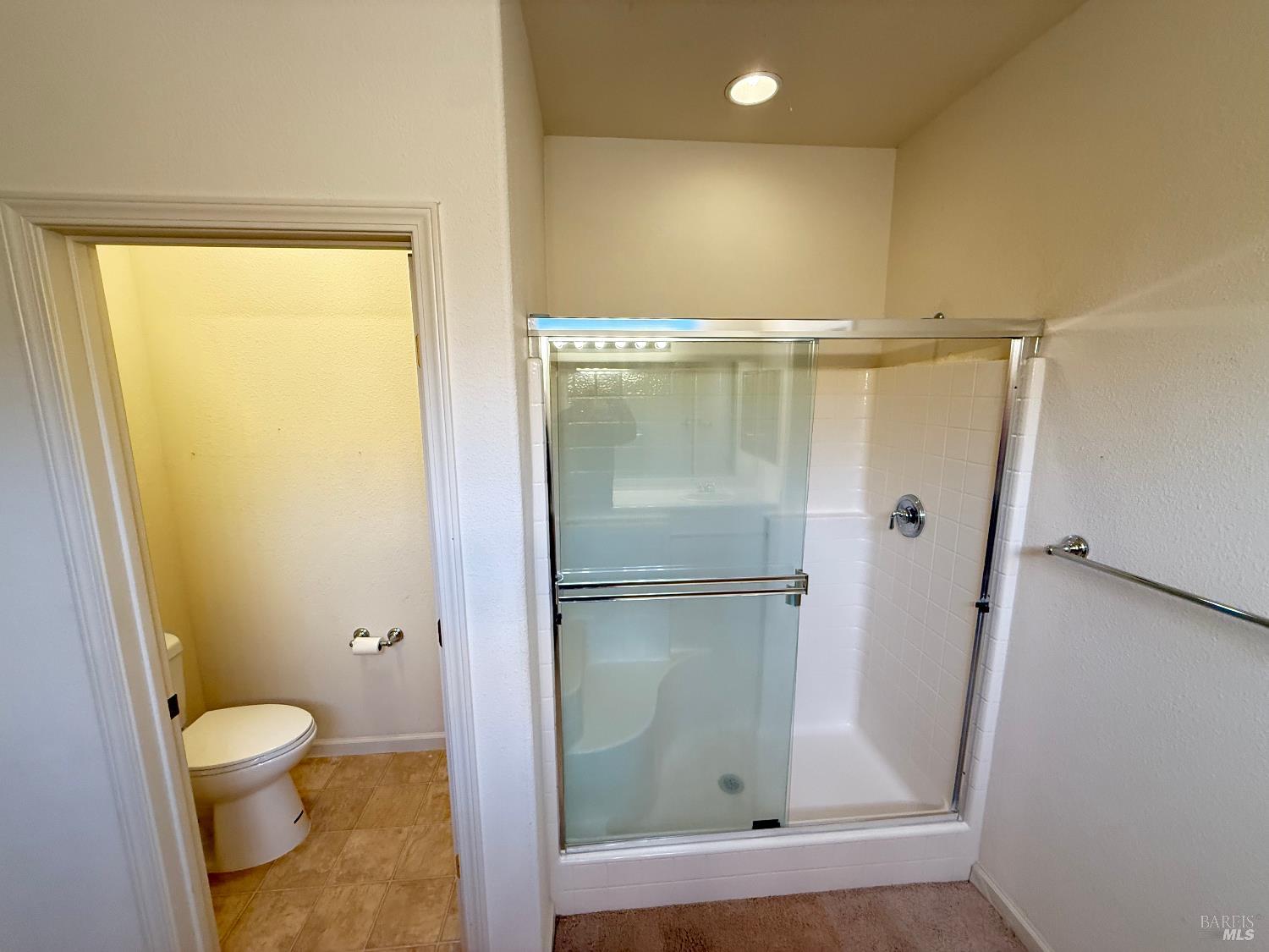 338 Gold Hills Drive Rio Vista, CA 94571 - Photo 17 of 27 a bathroom with a glass shower door
