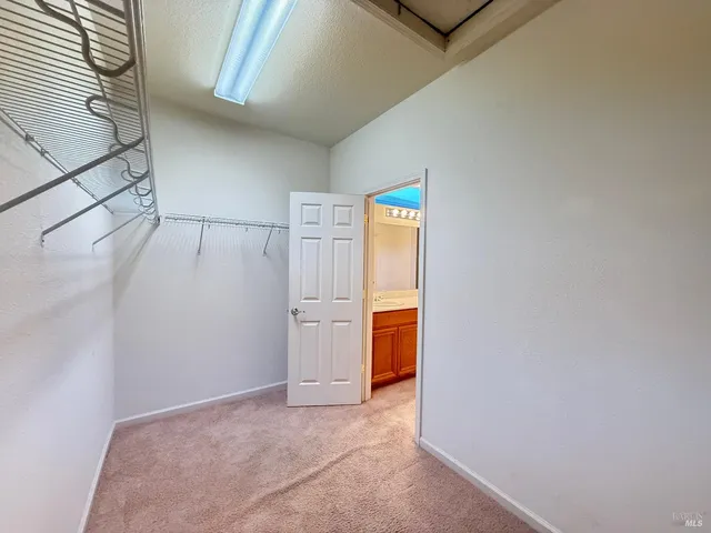 a view of a bathroom with a tub and shower