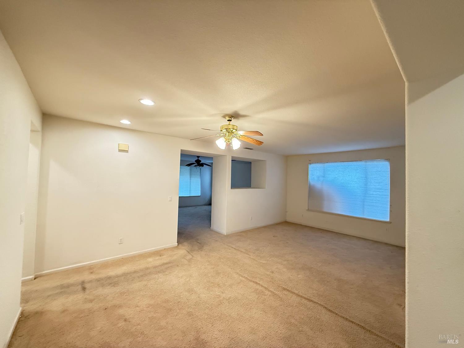 338 Gold Hills Drive Rio Vista, CA 94571 - Photo 21 of 27 an empty room with a ceiling fan and a window