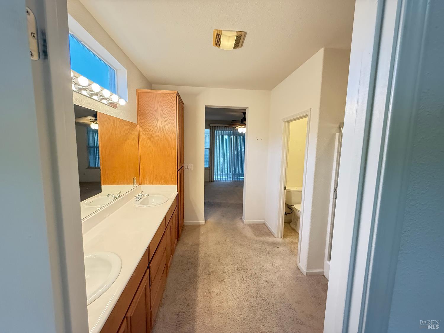 338 Gold Hills Drive Rio Vista, CA 94571 - Photo 6 of 27 a view of a hallway with wooden floor and staircase