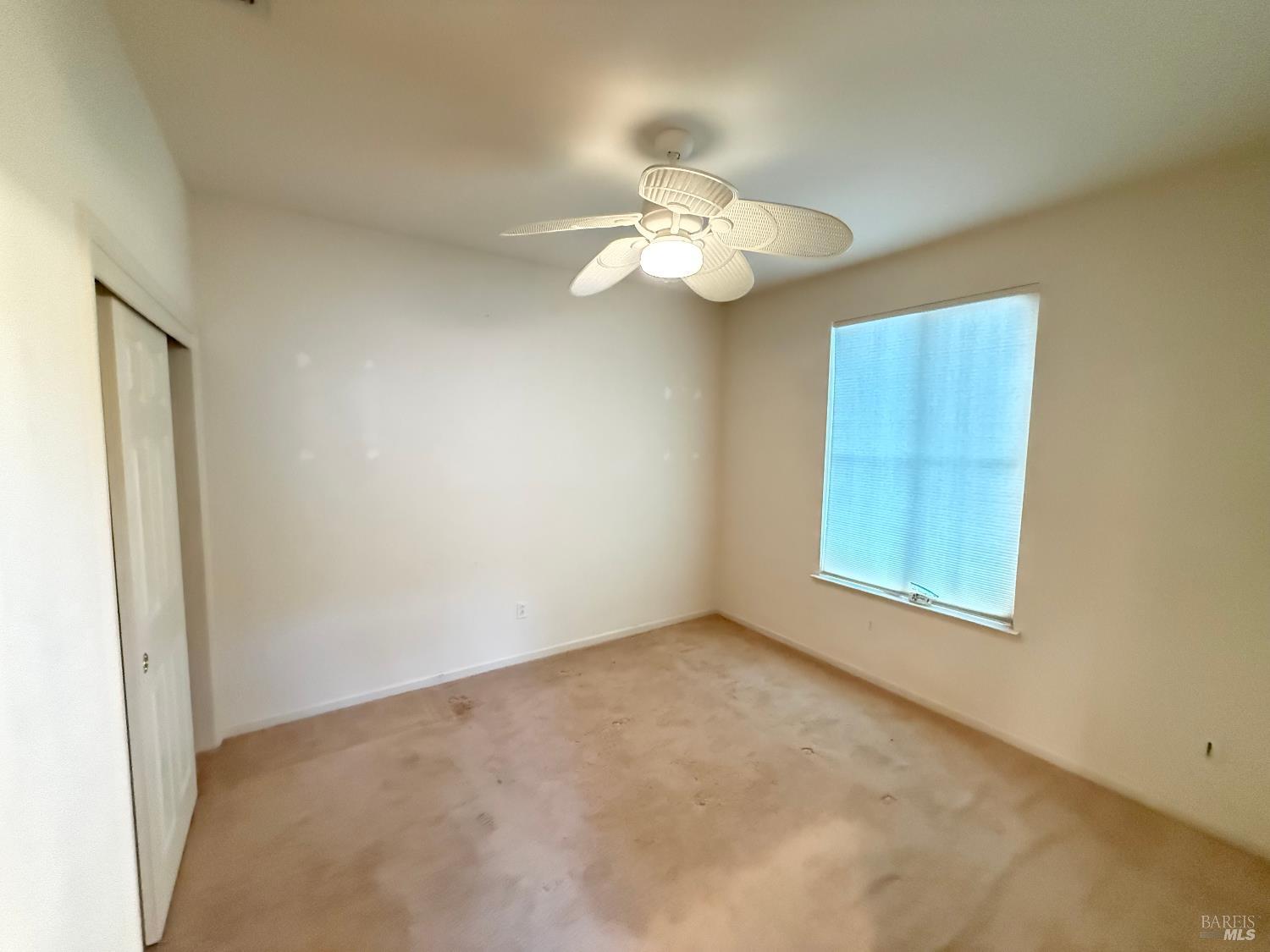 338 Gold Hills Drive Rio Vista, CA 94571 - Photo 10 of 27 an empty room with a window and ceiling fan