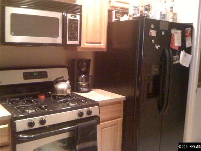 900 S Meadows, Unit 2423 Reno, NV 89521 - Photo 6 of 11 a close view of a stove top oven and cabinets