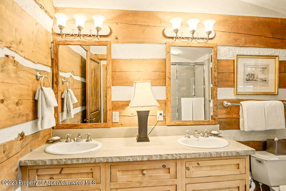 26 Altamira Ranch Road Basalt, CO 81621 - Photo 18 of 40 a bathroom with a granite countertop sink and a mirror