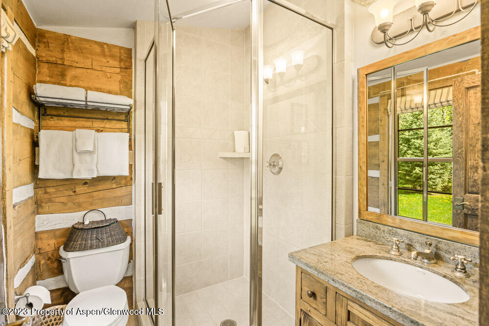 26 Altamira Ranch Road Basalt, CO 81621 - Photo 21 of 40 a bathroom with a granite countertop sink toilet and shower