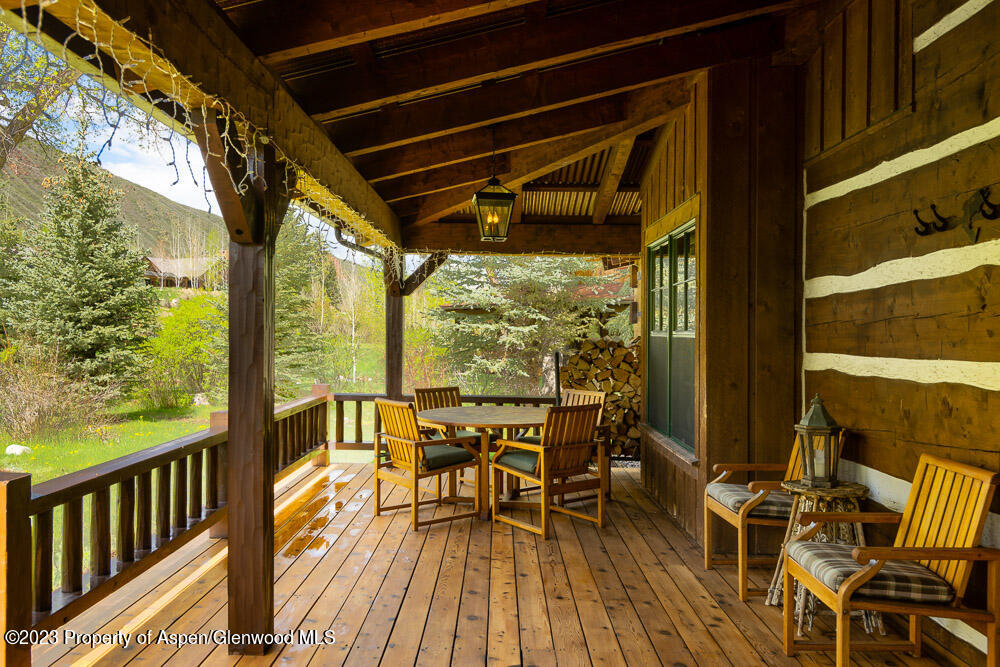 26 Altamira Ranch Road Basalt, CO 81621 - Photo 27 of 40 a view of balcony with chairs and wooden floor