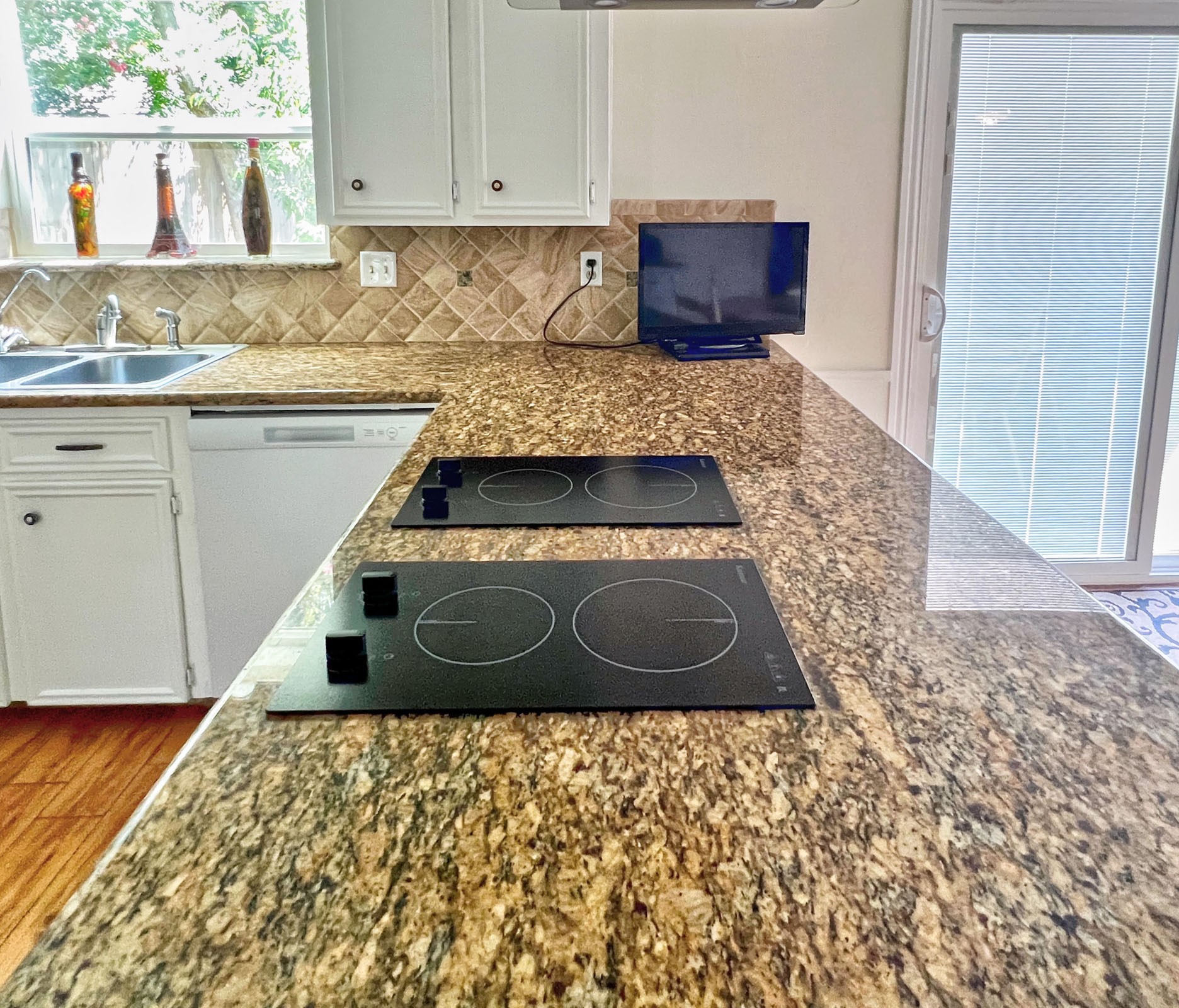 16902 Summit Oaks Lane Spring, TX 77379 - Photo 22 of 49 a kitchen with a stove and cabinets