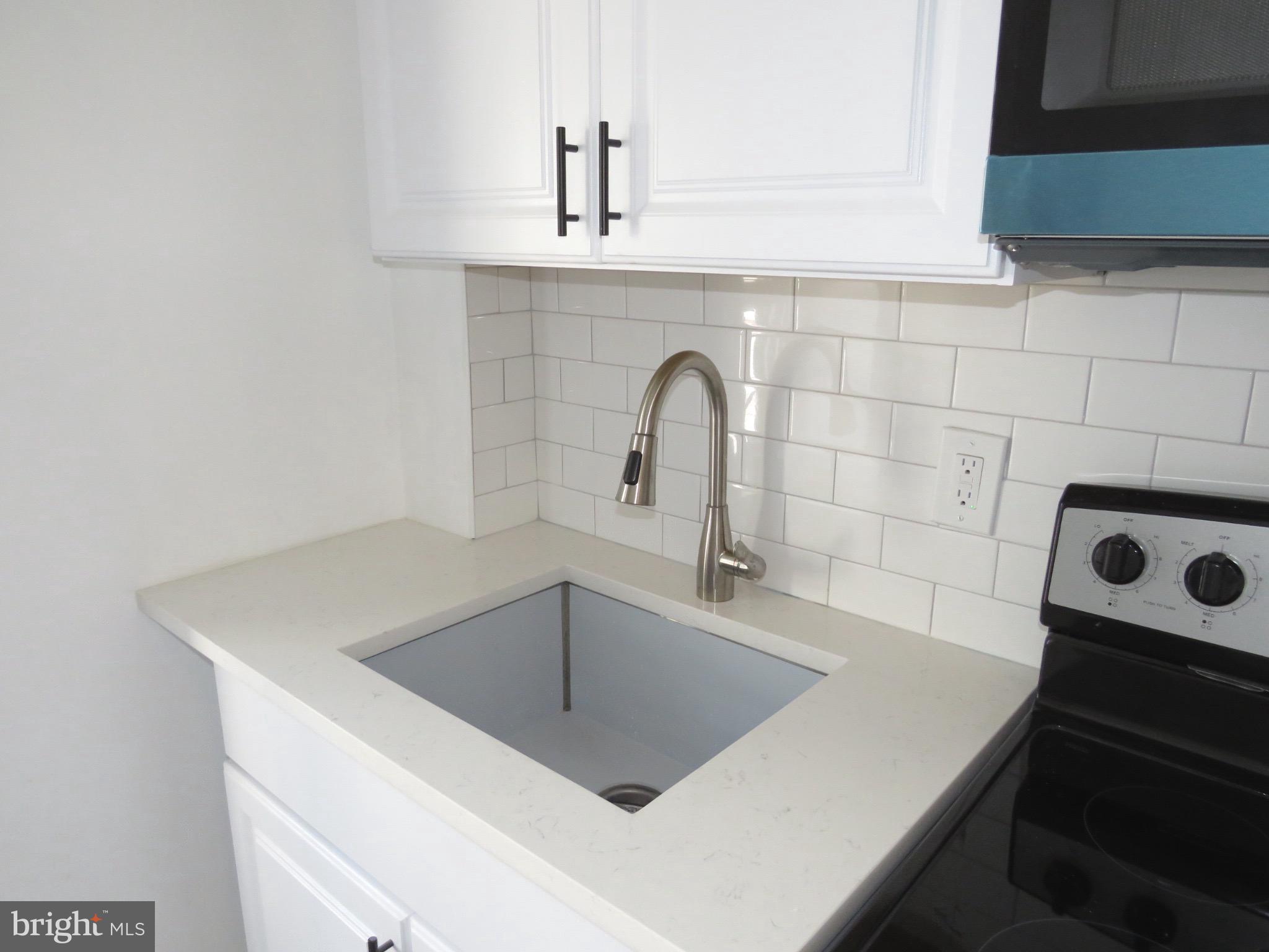 356 East Walnut Lane, Unit 3 Philadelphia, PA 19144 - Photo 4 of 18 a close view of sink and tap