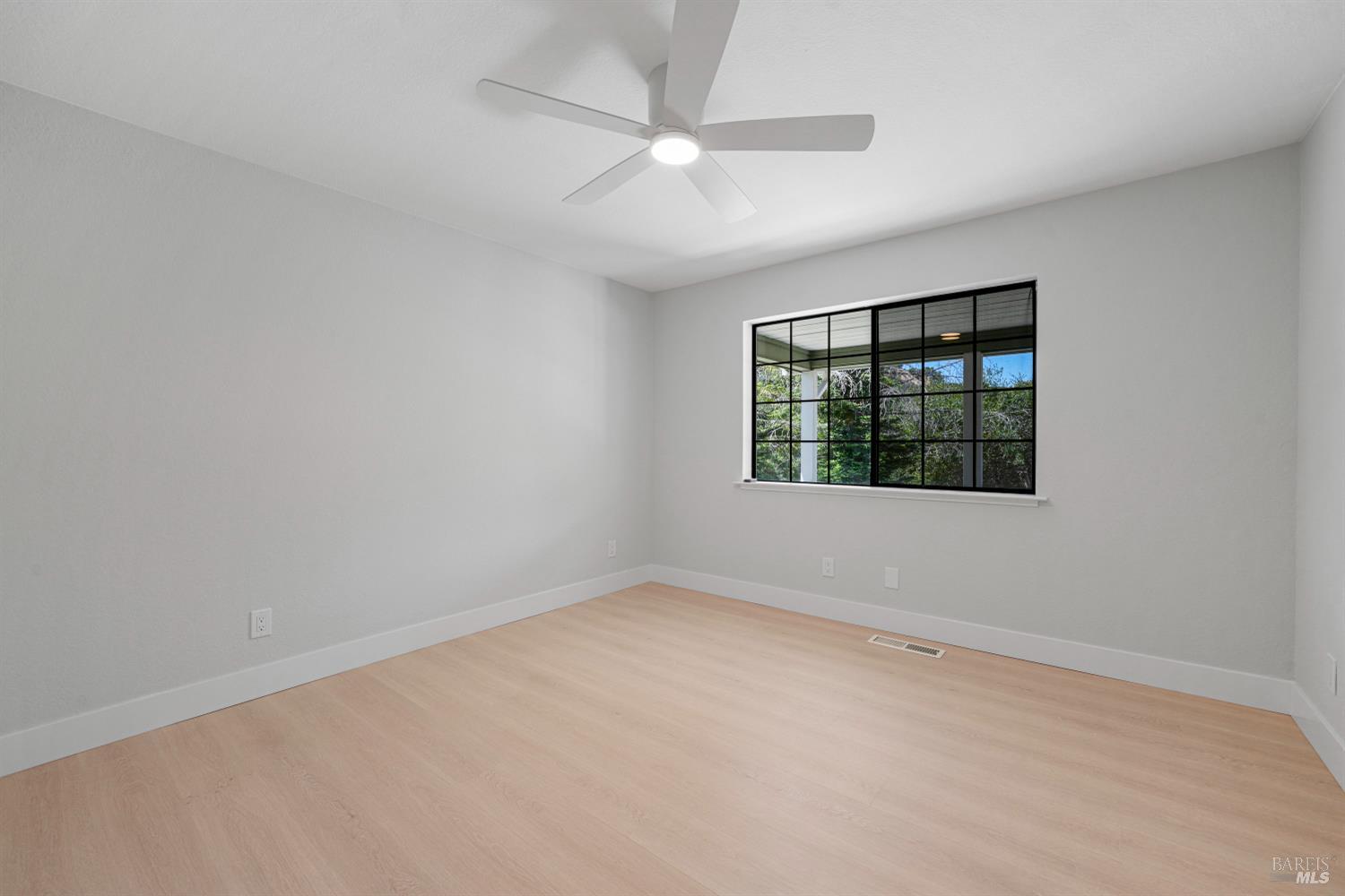 2129 Rockville Road Fairfield, CA 94534 - Photo 34 of 59 an empty room with a window and a ceiling fan