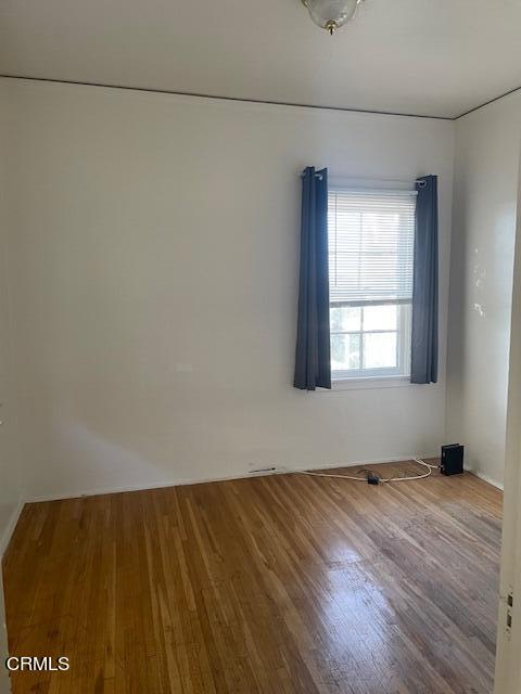 772 Poli Street, Unit E Ventura, CA 93001 - Photo 7 of 9 a view of an empty room and window