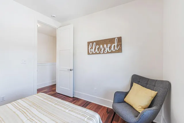 a bedroom with a bed and a couch