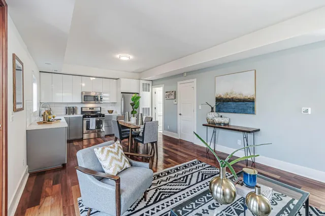a living room with furniture and a table