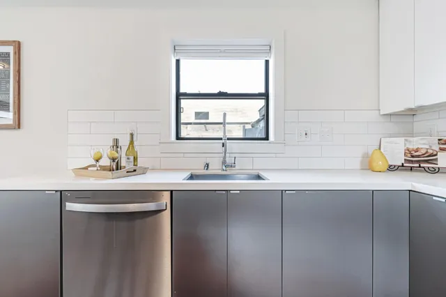 a kitchen with a sink and window