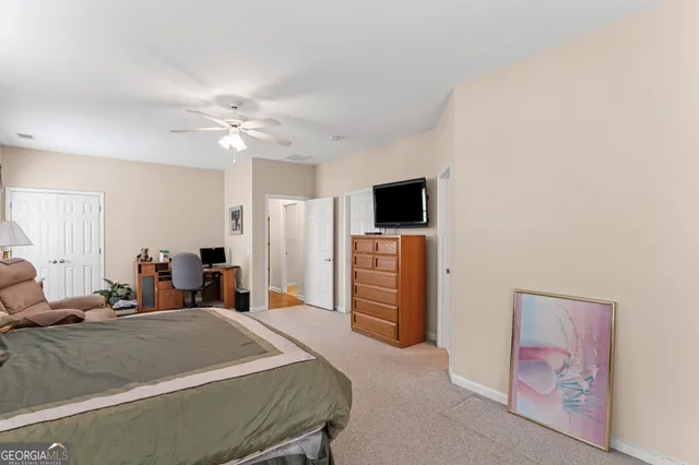 a bed room with a bed and a television