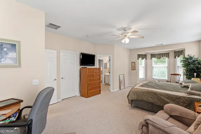 a bedroom with furniture and a window