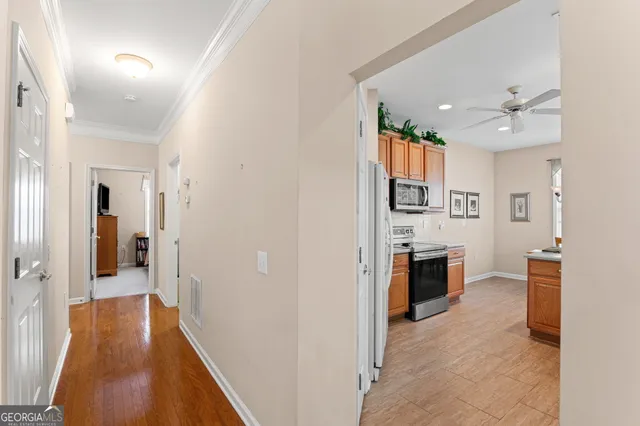 a view of a kitchen from the hallway
