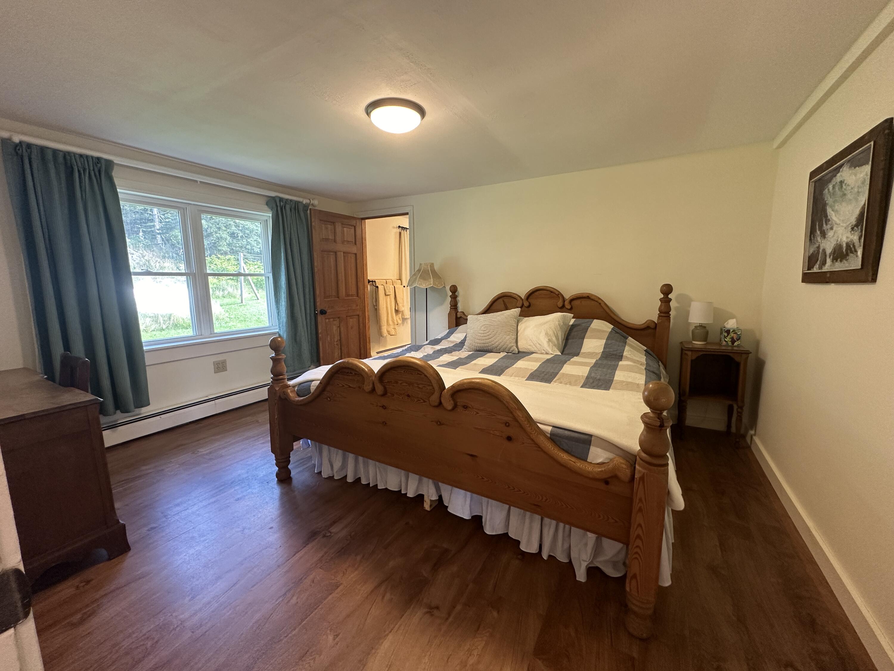 338 Johnson Cove Road Roque Bluffs, ME 04654 - Photo 25 of 49 1st Floor Bedroom 1 from Living Room