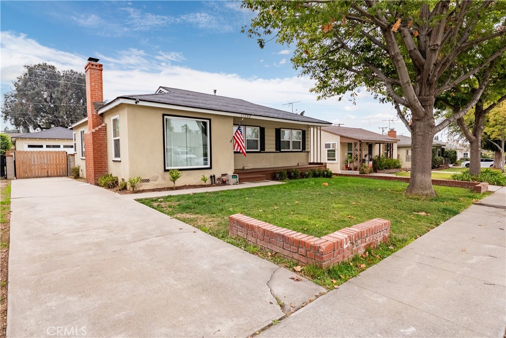 11302 Maple Street Whittier, CA 90601 - Photo 1 of 1 a front view of a house with a yard and trees