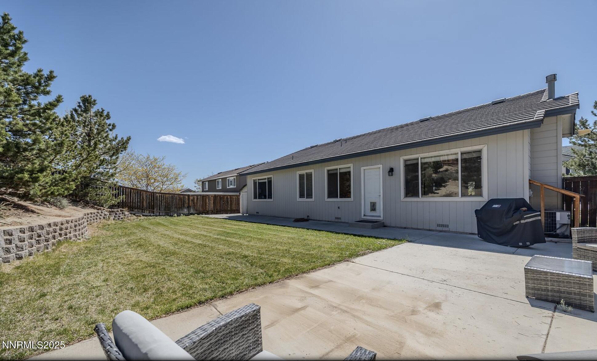 4080 Twin Falls Drive Reno, NV 89511 - Photo 11 of 16 a house view with a backyard space
