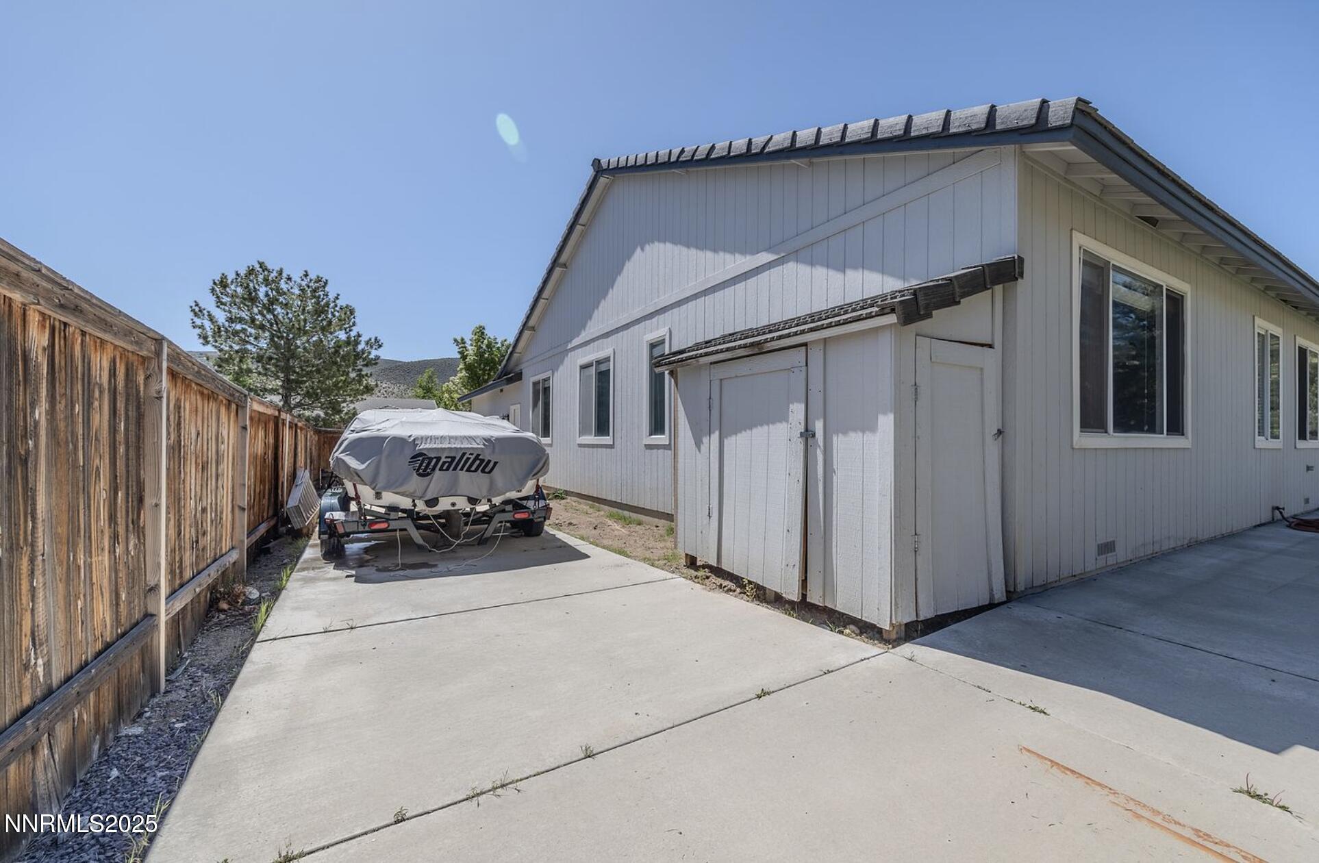 4080 Twin Falls Drive Reno, NV 89511 - Photo 13 of 16 a view of a house with backyard and parking