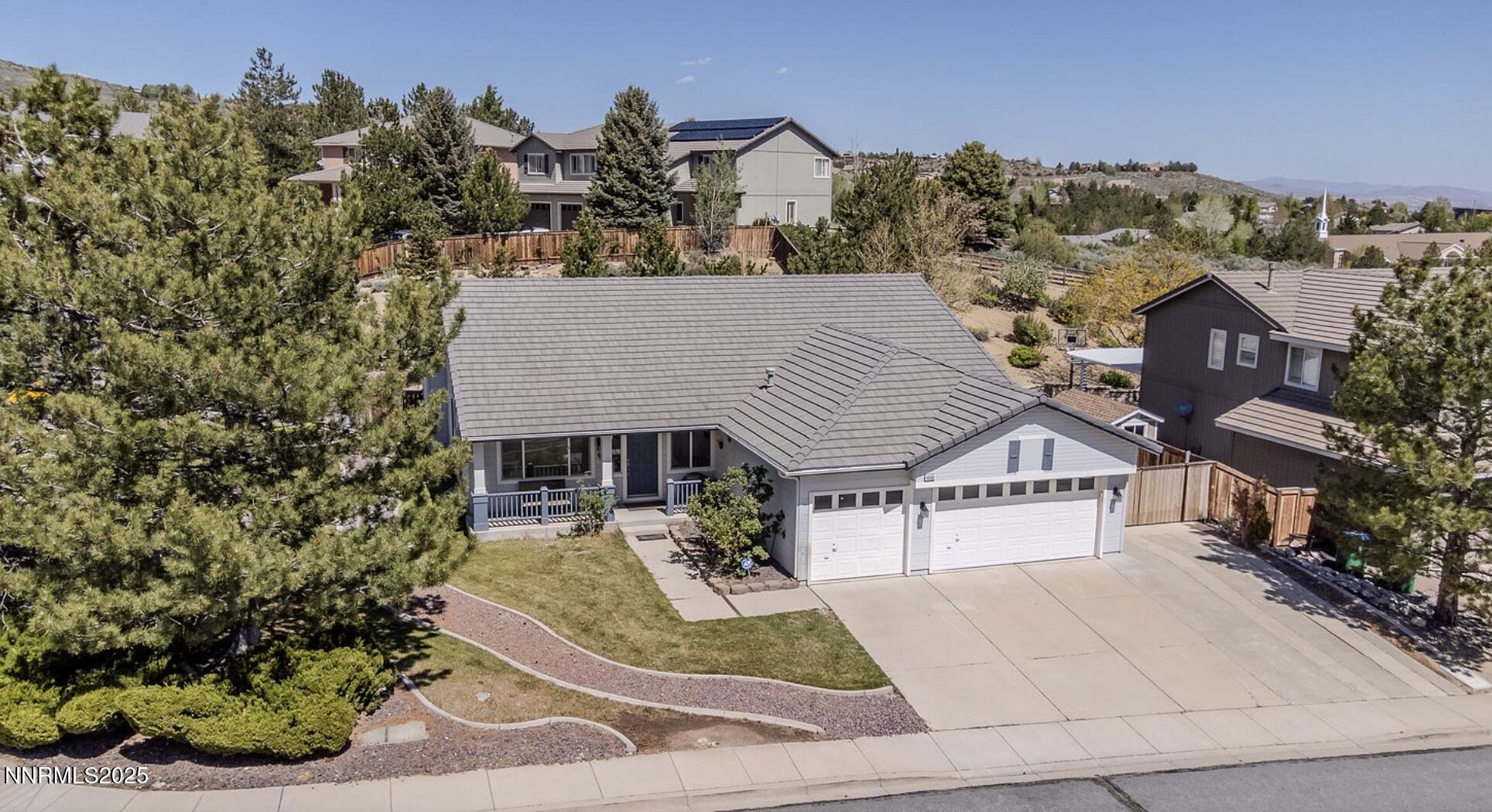 4080 Twin Falls Drive Reno, NV 89511 - Photo 14 of 16 front view of a house with a garden