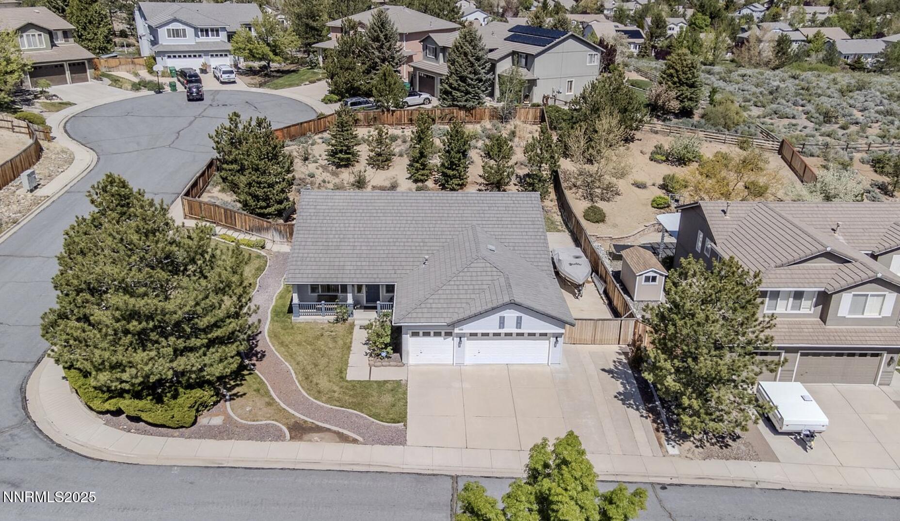4080 Twin Falls Drive Reno, NV 89511 - Photo 15 of 16 an aerial view of a house with a yard and large trees