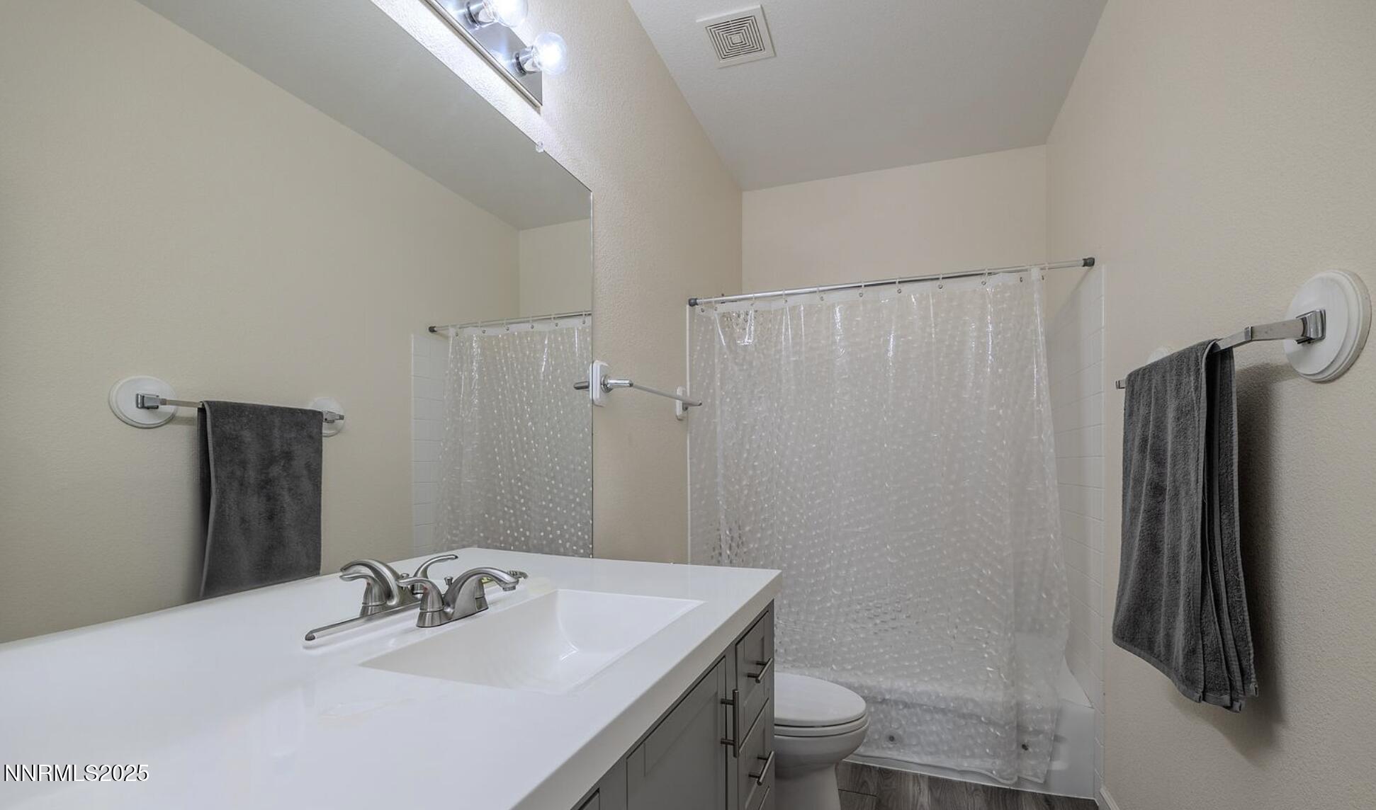 4080 Twin Falls Drive Reno, NV 89511 - Photo 7 of 16 a bathroom with a sink toilet and shower