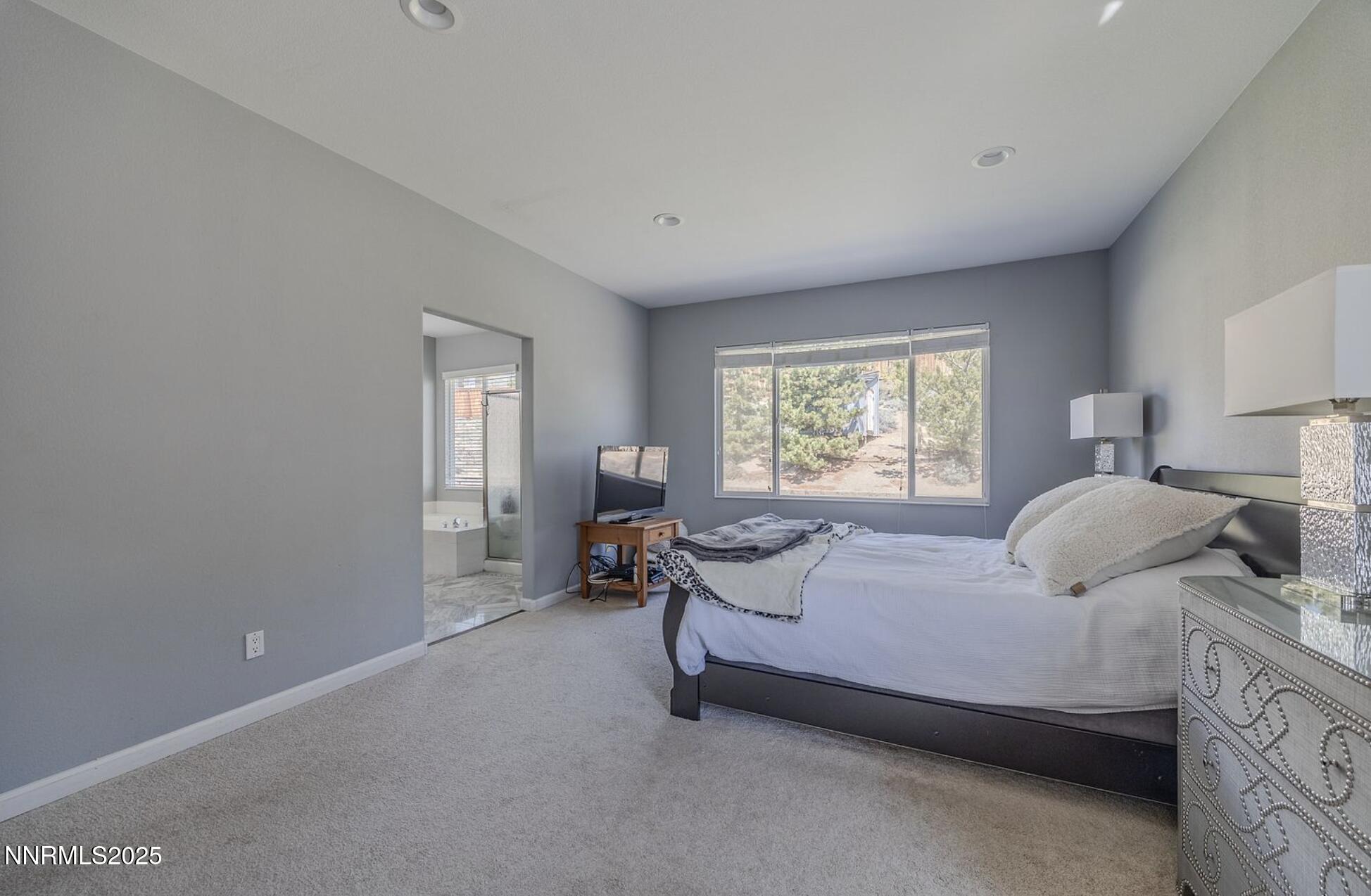 4080 Twin Falls Drive Reno, NV 89511 - Photo 8 of 16 a bedroom with a bed and a window