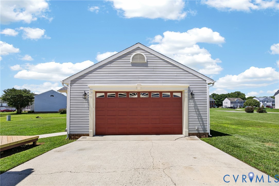 1559 Tree Ridge Road Henrico, VA 23231 - Photo 37 of 40 Detached garage with red overhead door, window pan