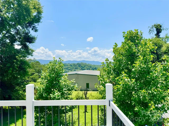 a view of a balcony with an outdoor space