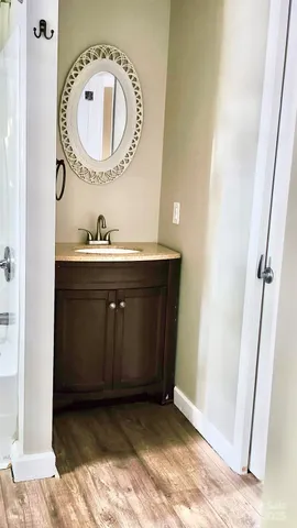 a view of a living room with a floor to ceiling window and an outdoor area