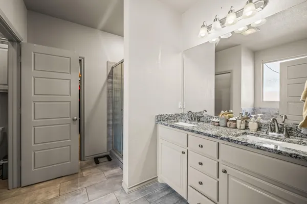 a bathroom with a tub and a sink